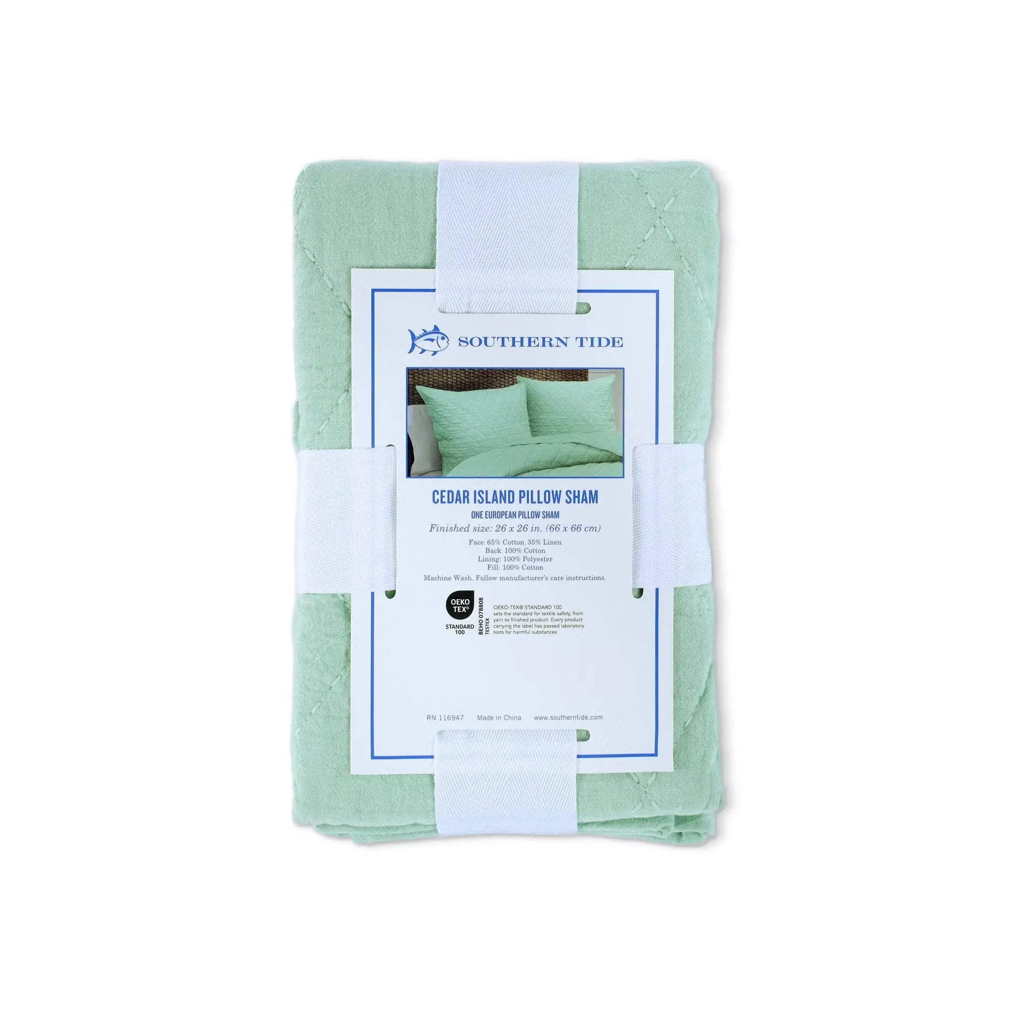 A folded sage green pillow sham with a white paper label wrapped around it, displayed on a clean white background. The label is branded 'Southern Tide' and identifies the product as 'Cedar Island Pillow Sham'.