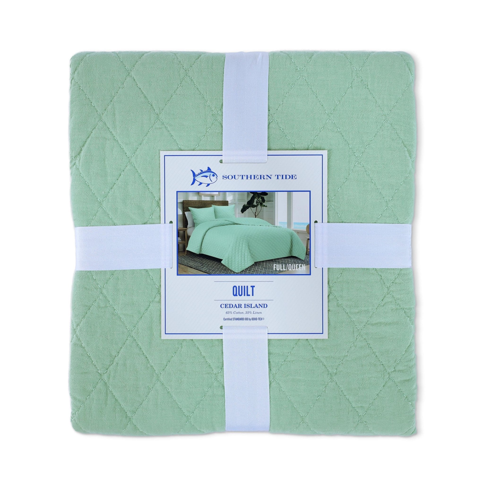 Front view of green quilt packaging with a tag displaying 'Southern Tide' on a white background