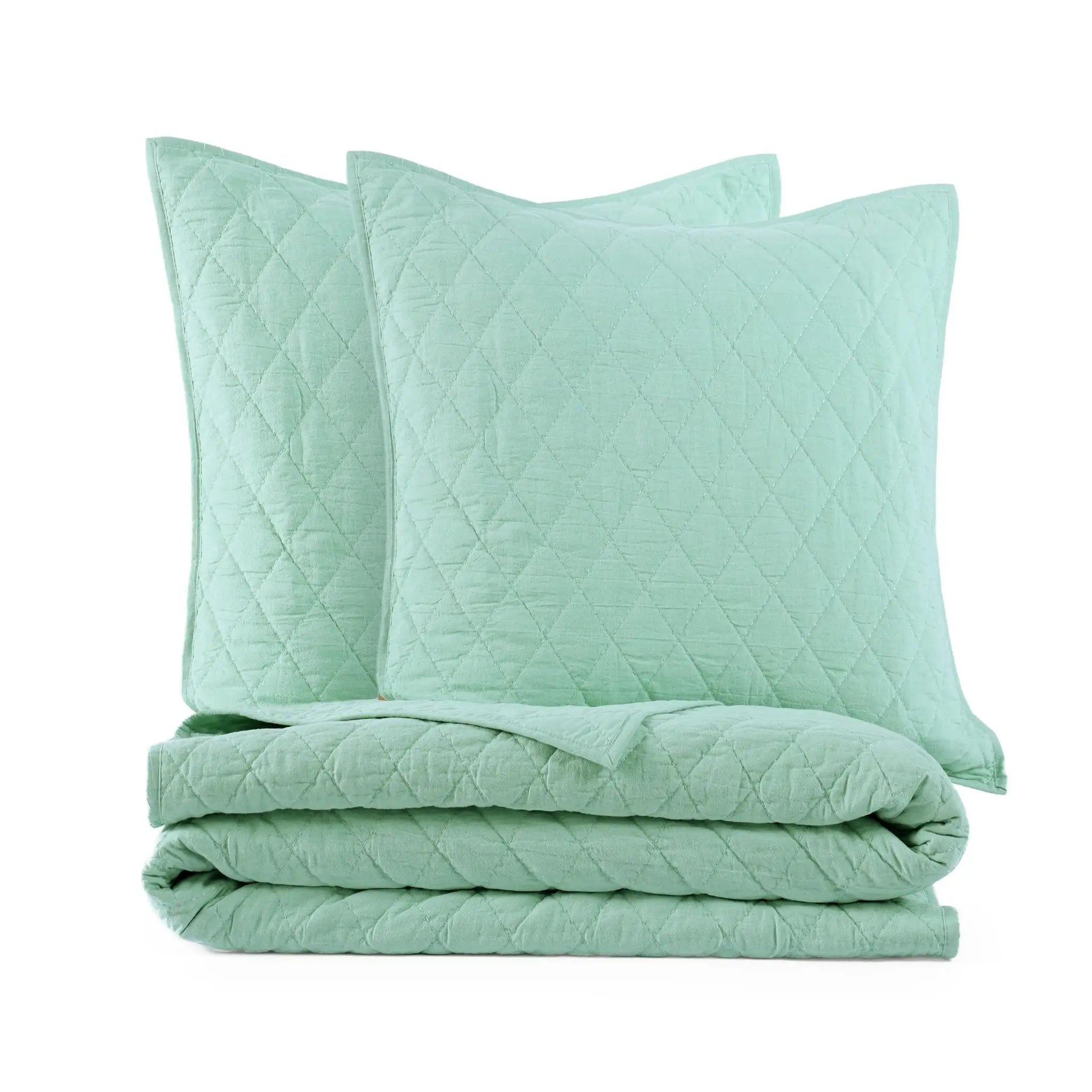 Mint green quilt and euro set on a white background