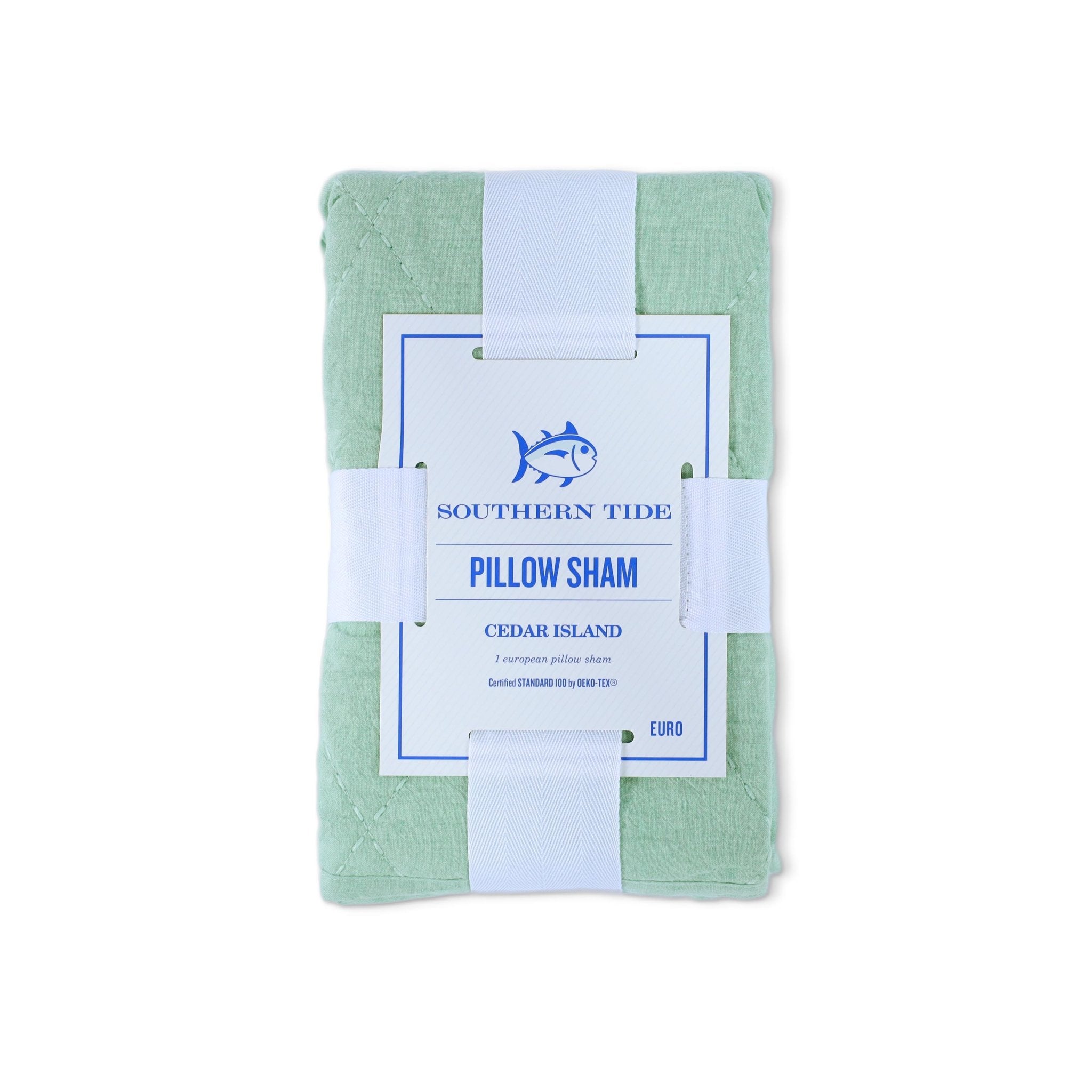 Front view of green euro sham with packaging with a label on a white background