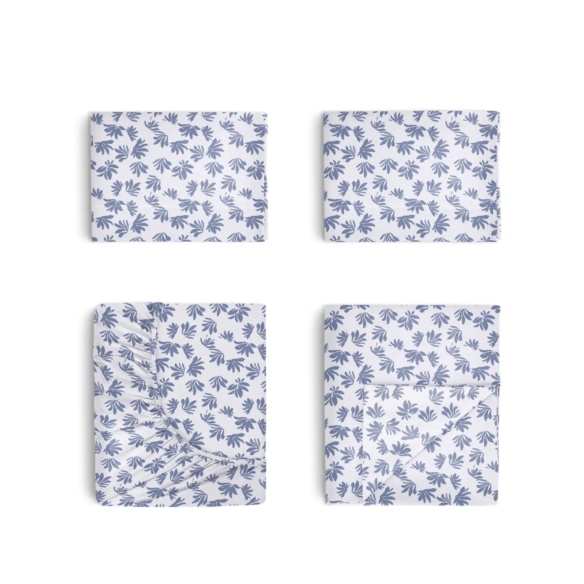 Four folded rectangular fabric pieces arranged in a 2x2 grid on a white background, each showing a repeating blue leaf or palm-like print on a white base.