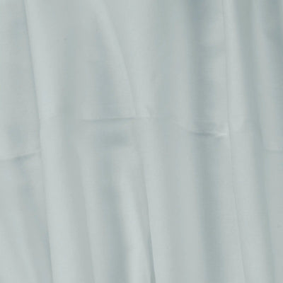 A close-up of light gray fabric with soft folds and a smooth texture.