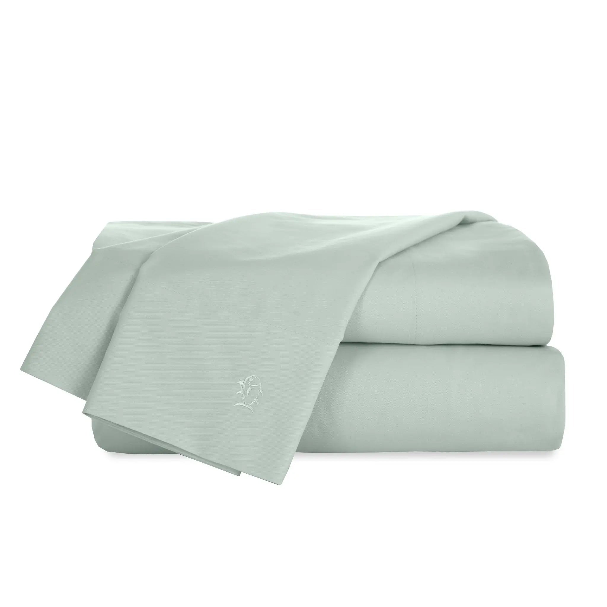 Set of sage bed sheets on a white background
