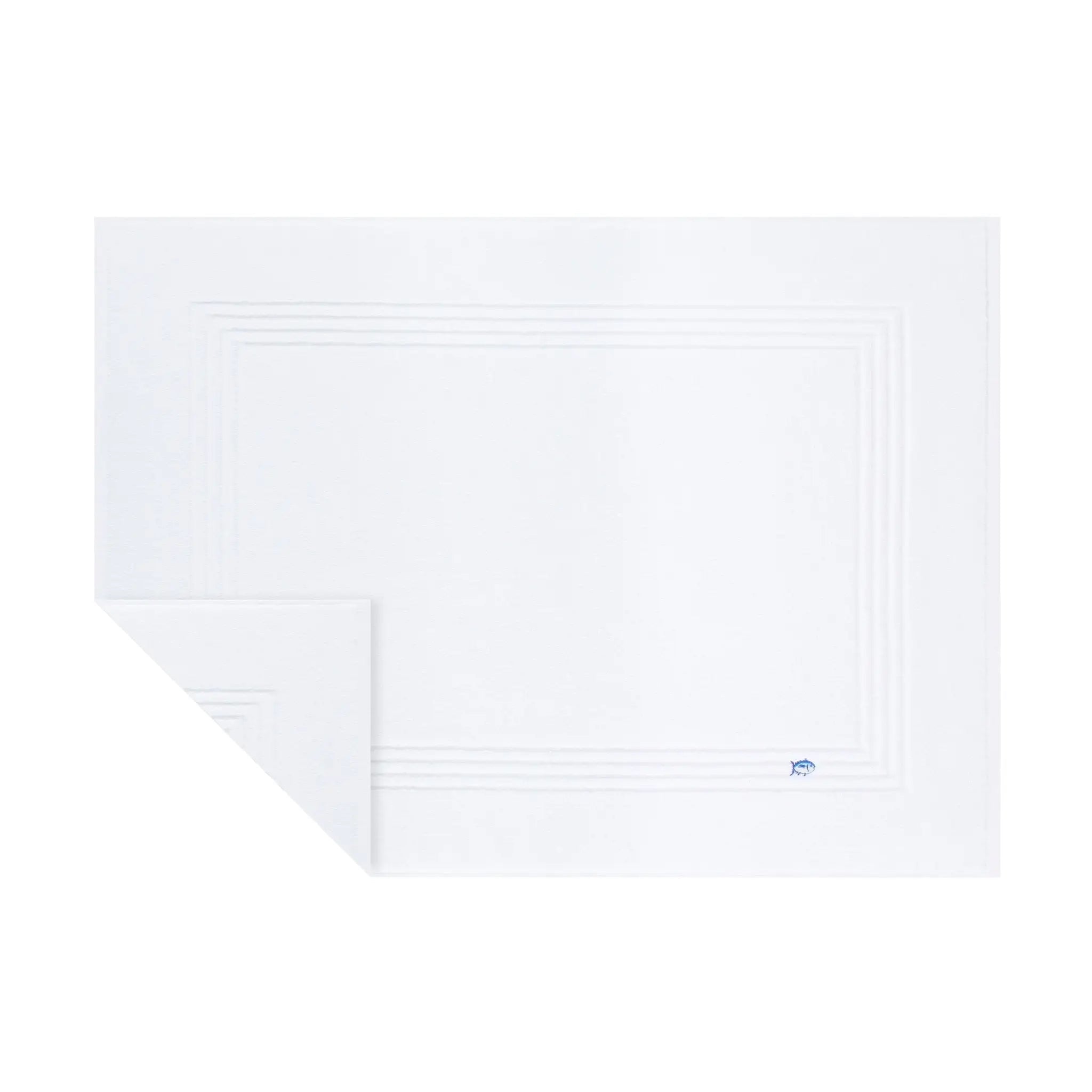 A white bath mat with a subtle concentric border design and a small blue logo in the bottom right corner, shown on a plain white background.