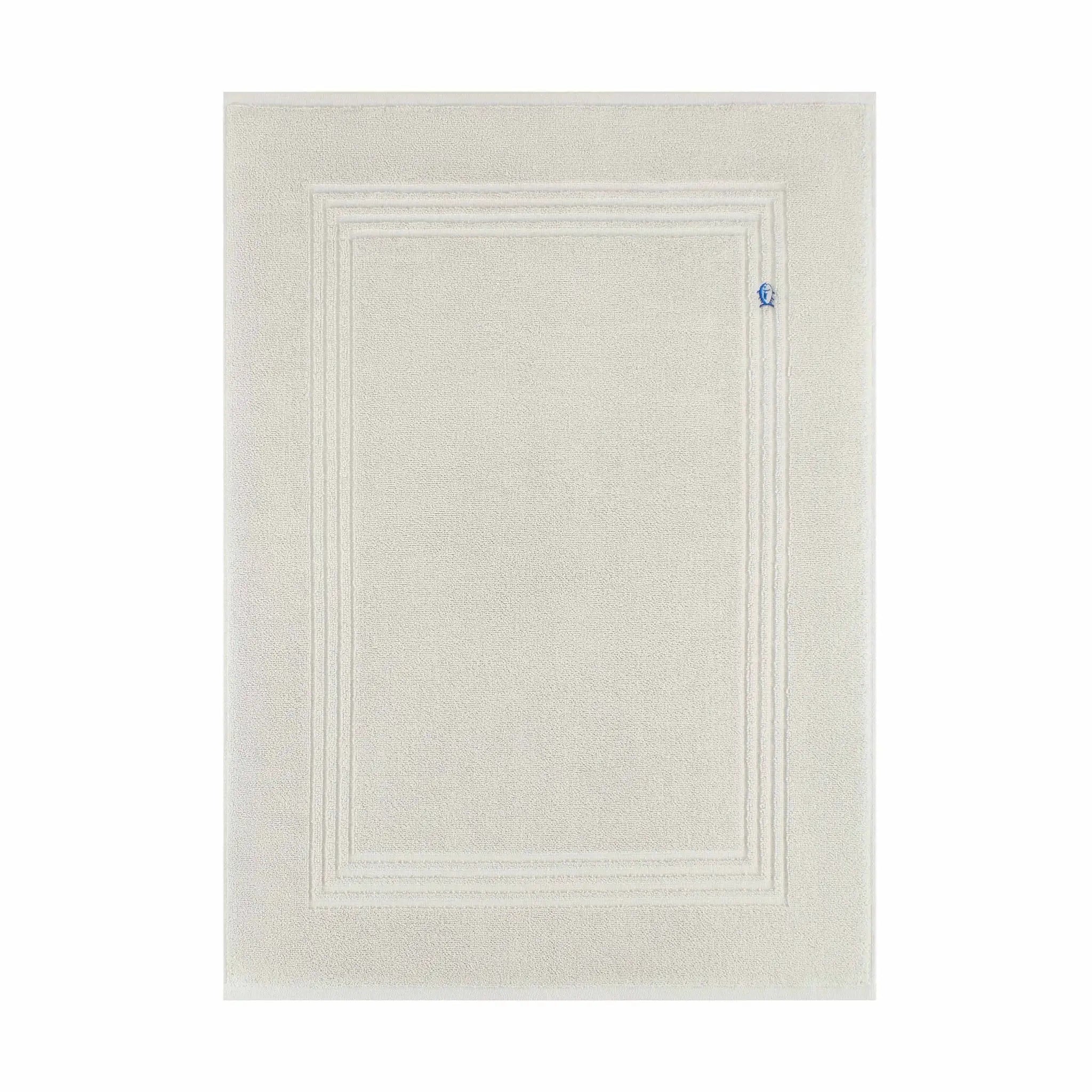A grey bath mat with a raised double-line border design and a small blue tag on the right side, shown against a plain white background.