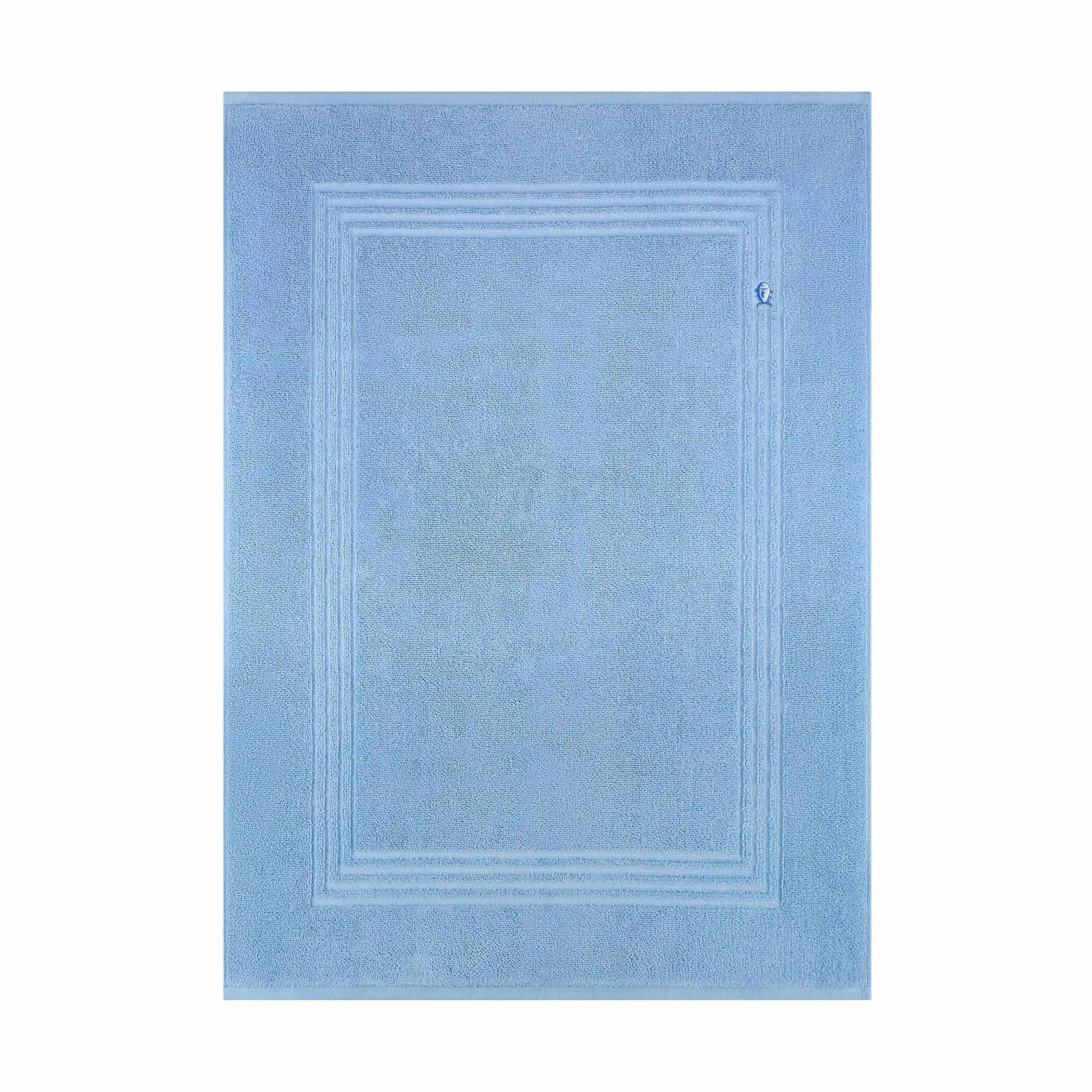 A blue bath mat, shown flat against a plain white background.