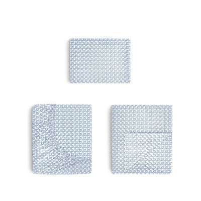 Three blue geometric patterned sheets on a white background