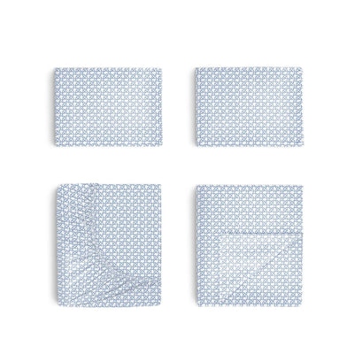 Four blue geometric patterned sheets on a white background