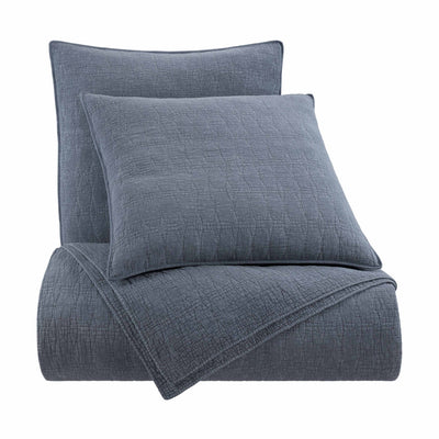 Blue textured bedding set with two euro shams on a white background
