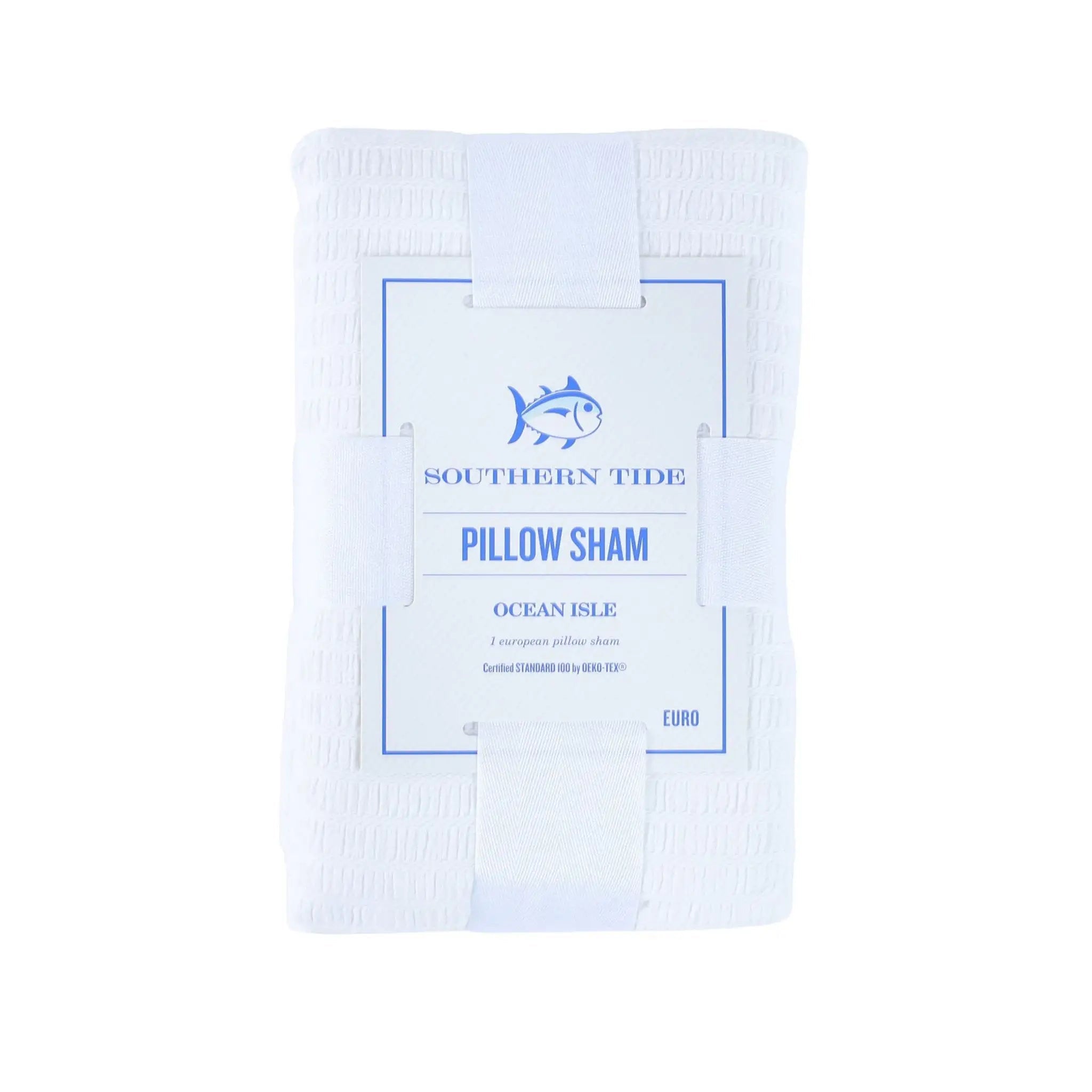 A folded white pillow sham with a central paper label that reads 'SOUTHERN TIDE PILLOW SHAM OCEAN ISLE' and shows a blue fish logo, on a plain white background.
