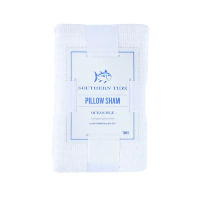 A folded white pillow sham with a central paper label that reads 'SOUTHERN TIDE PILLOW SHAM OCEAN ISLE' and shows a blue fish logo, on a plain white background.