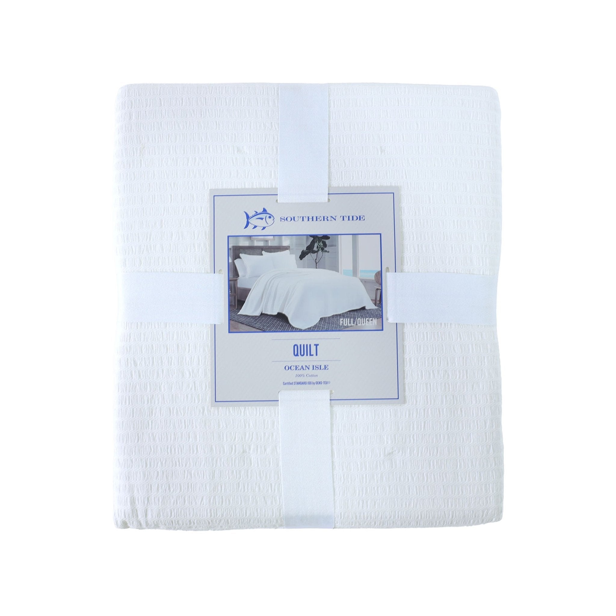 Front view of white quilt with packaging on a white background