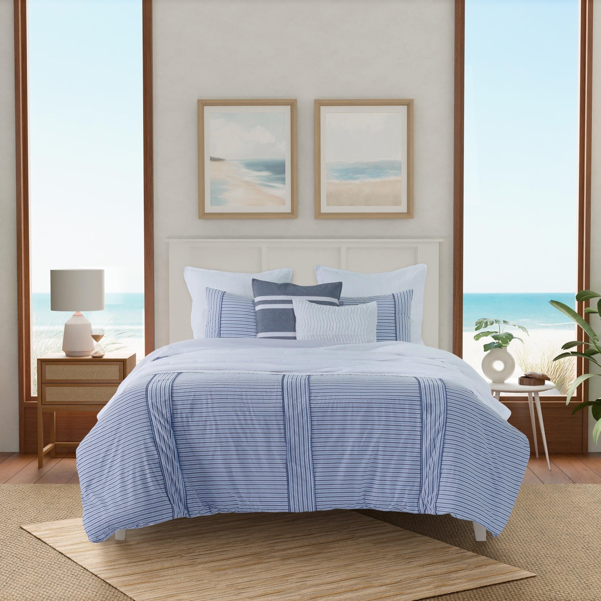 Bedroom with blue striped bedding.