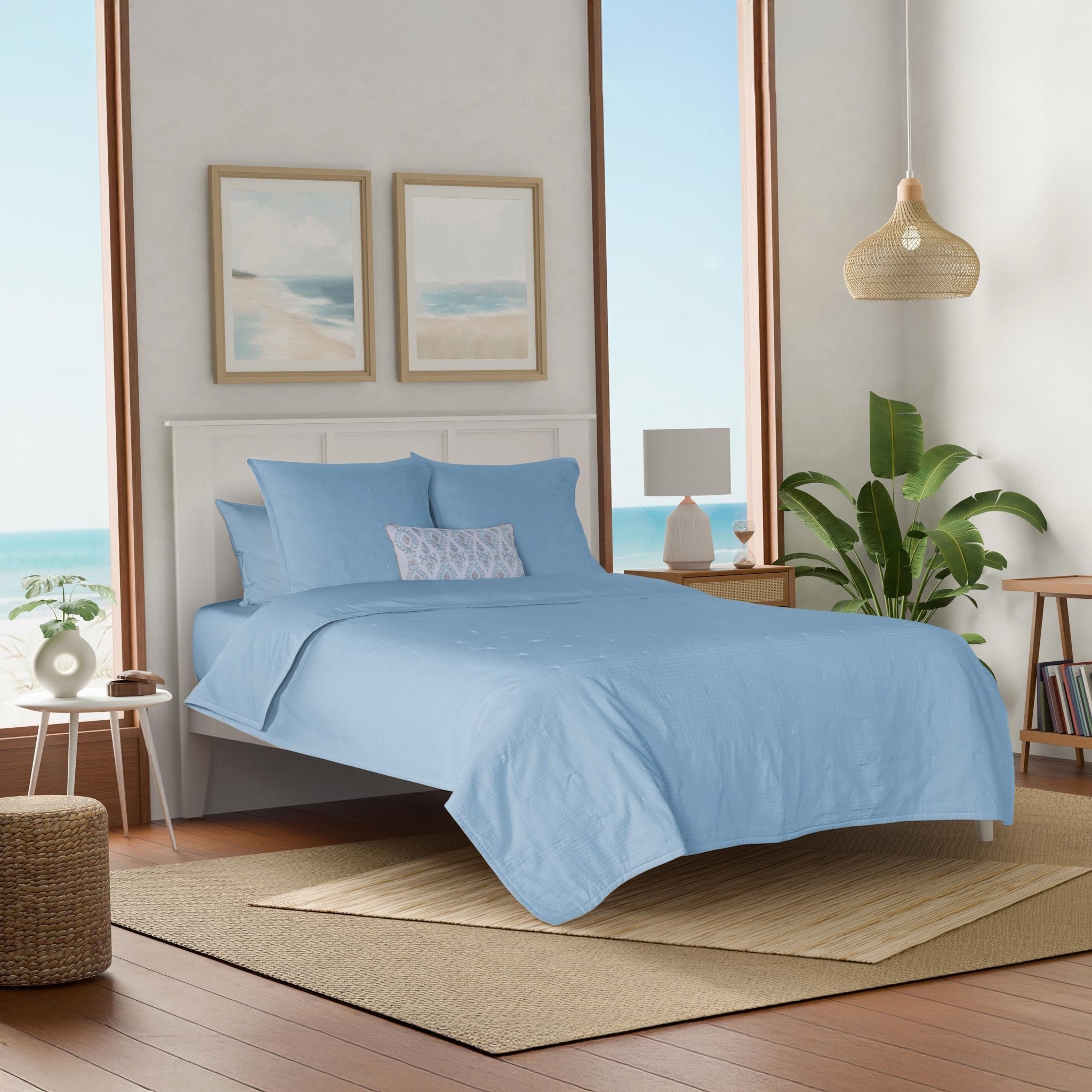 Bedroom with light blue bedding.