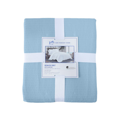 Blue quilt with back view packaging on a white background