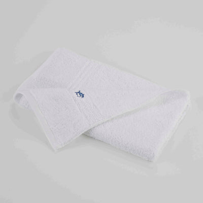 White hand towel with a blue logo on a light gray background