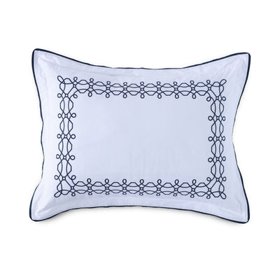 Front view of a sham with intricate black embroidery on a white background.