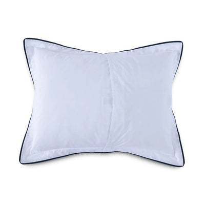Reverse side of white pillow sham with a thin dark navy blue piped border, shown flat against a solid white background.