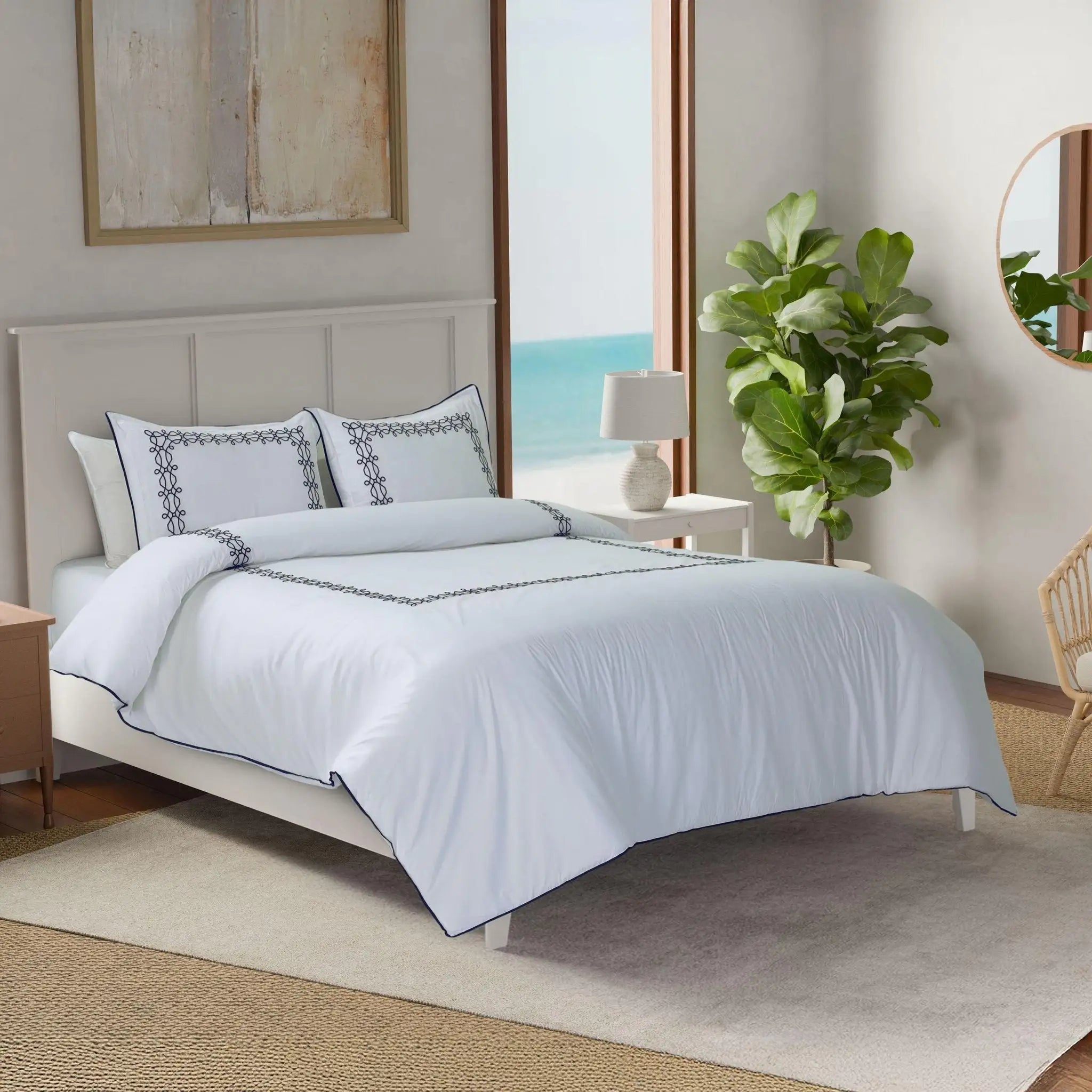 Neatly made bed with white bedding in a well-lit bedroom.