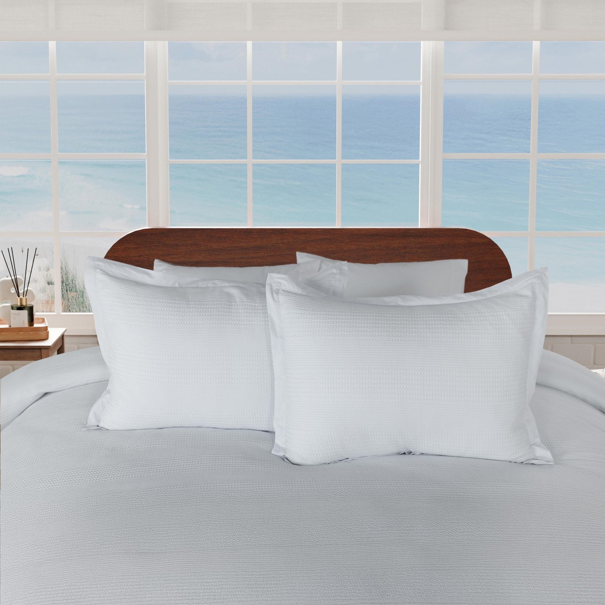 Grey shams paired with comforter on a neatly made bed