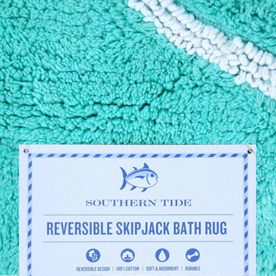 Reversible Skipjack bath rug with Southern Tide label on an aqua bath rug.