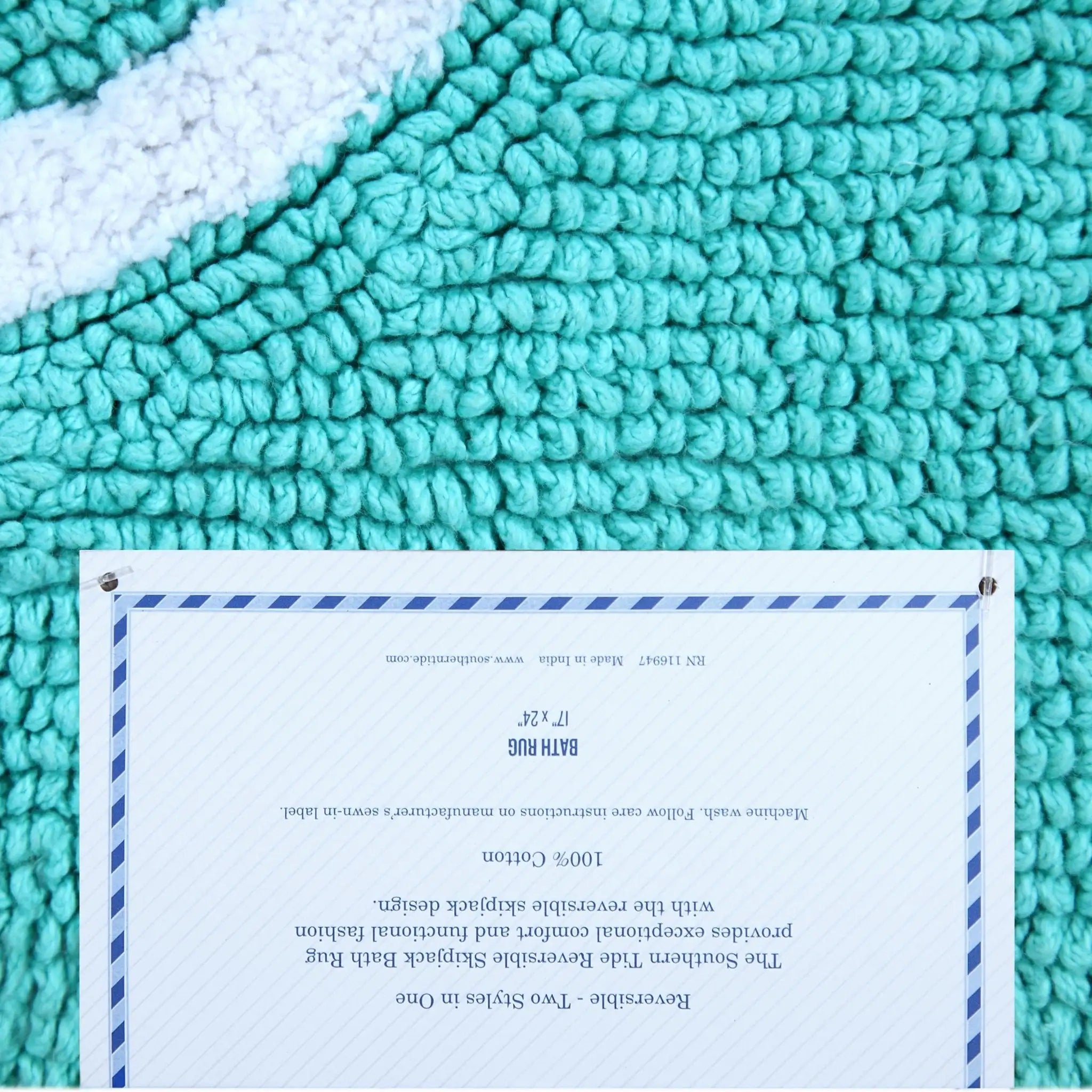Aqua rug with a label on a white background