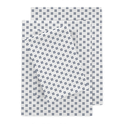 Percale sheet set featuring a white background with a navy blue floral pattern.