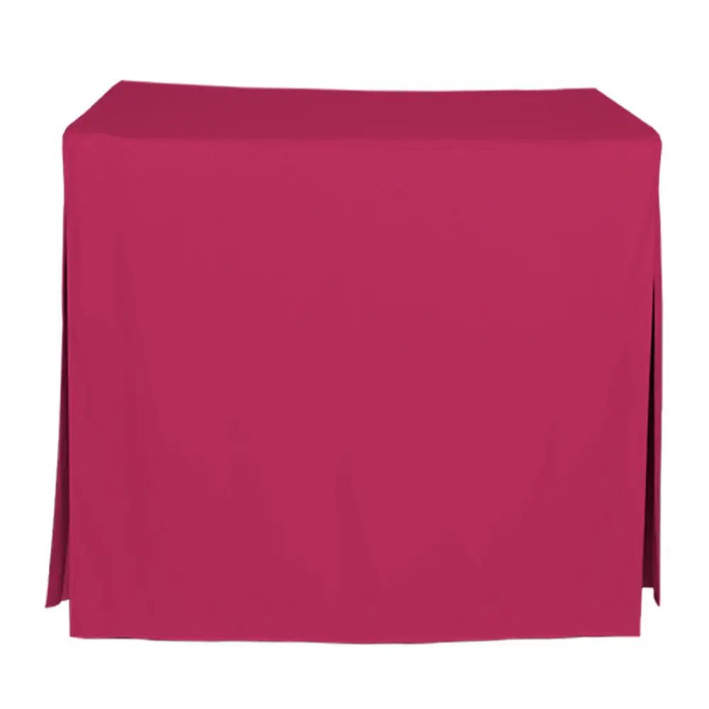 A pink tablecloth draped over a rectangular table, shown against a plain white background.