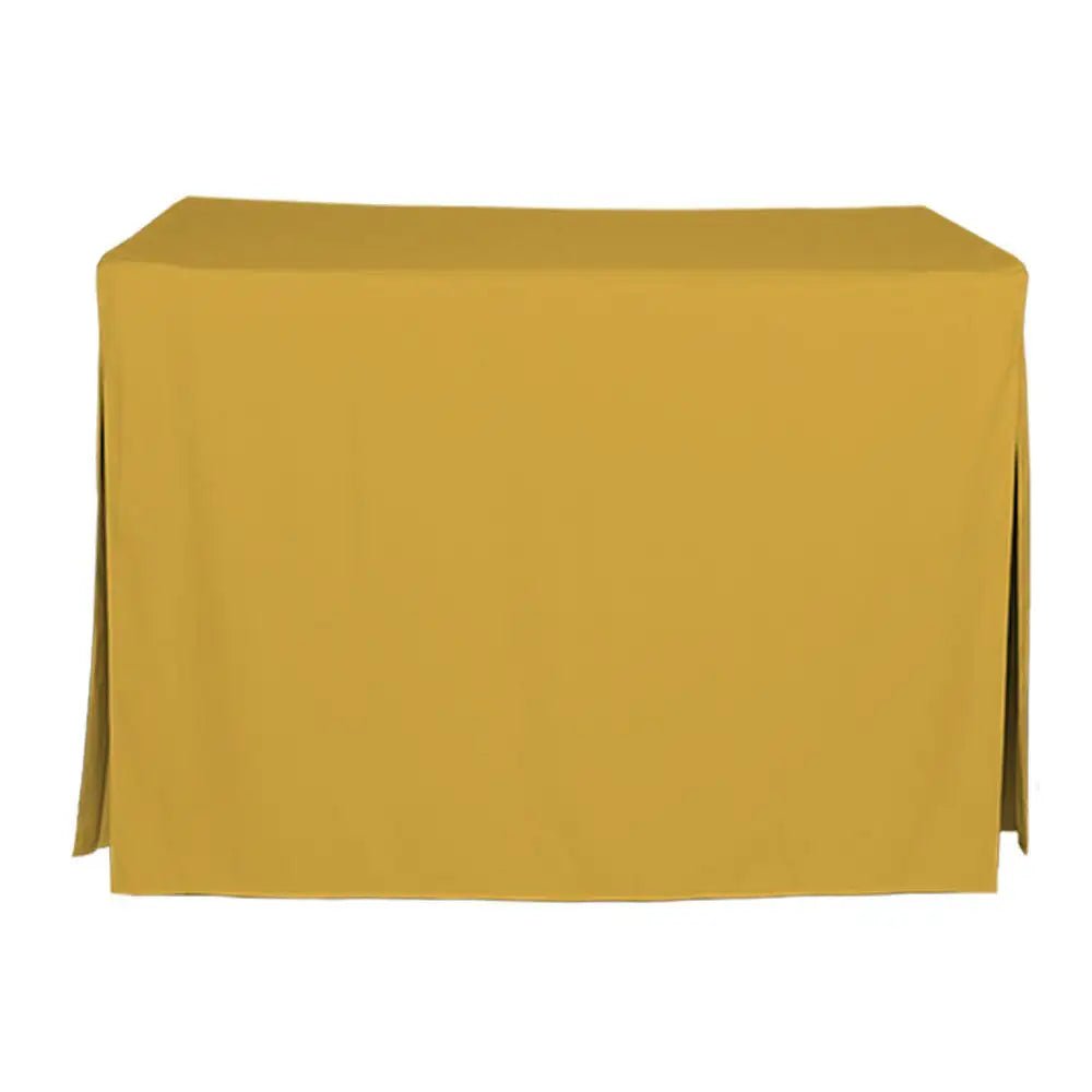 A mustard yellow tablecloth draped over a rectangular table, shown against a plain white background.