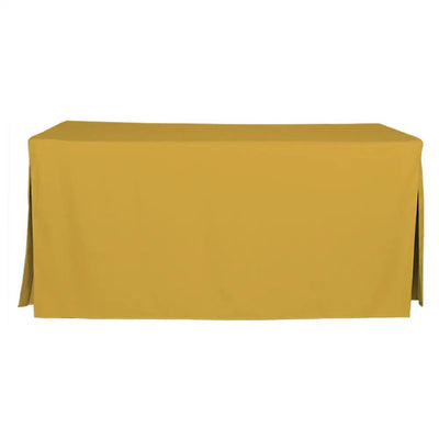 A mimosa color rectangular tablecloth draped over a table, shown against a plain white background.