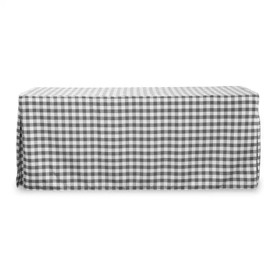 A rectangular table covered with a black and white gingham checkered tablecloth, shown against a plain white background.