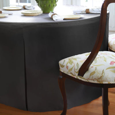Dining table with a black tablecloth.