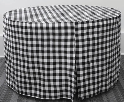 A round table covered in a black and white gingham checkered table skirt, shown against a neutral gray background.