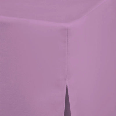 A close-up of a lavender lilac fitted table cover with a visible corner and a vertical pleat seam.