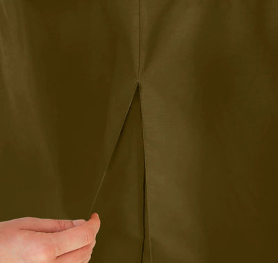 Close-up of brown fabric with a hand pulling slightly to show the material's drape and texture.