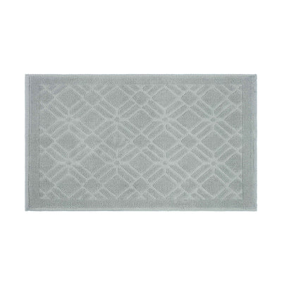 Rectangular bath rug in light gray with a geometric pattern and textured surface.