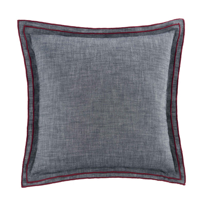 Square navy decorative pillow with a textured surface and contrasting red trim.