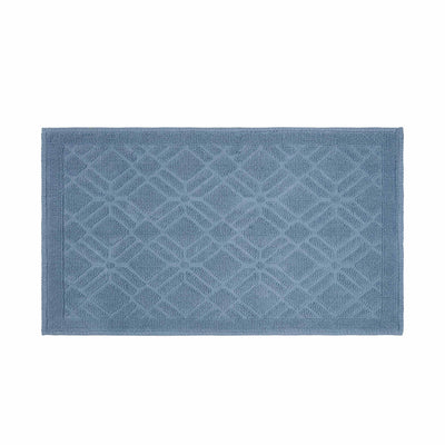 Rectangular bath rug in a soft blue color with a geometric pattern and textured surface.