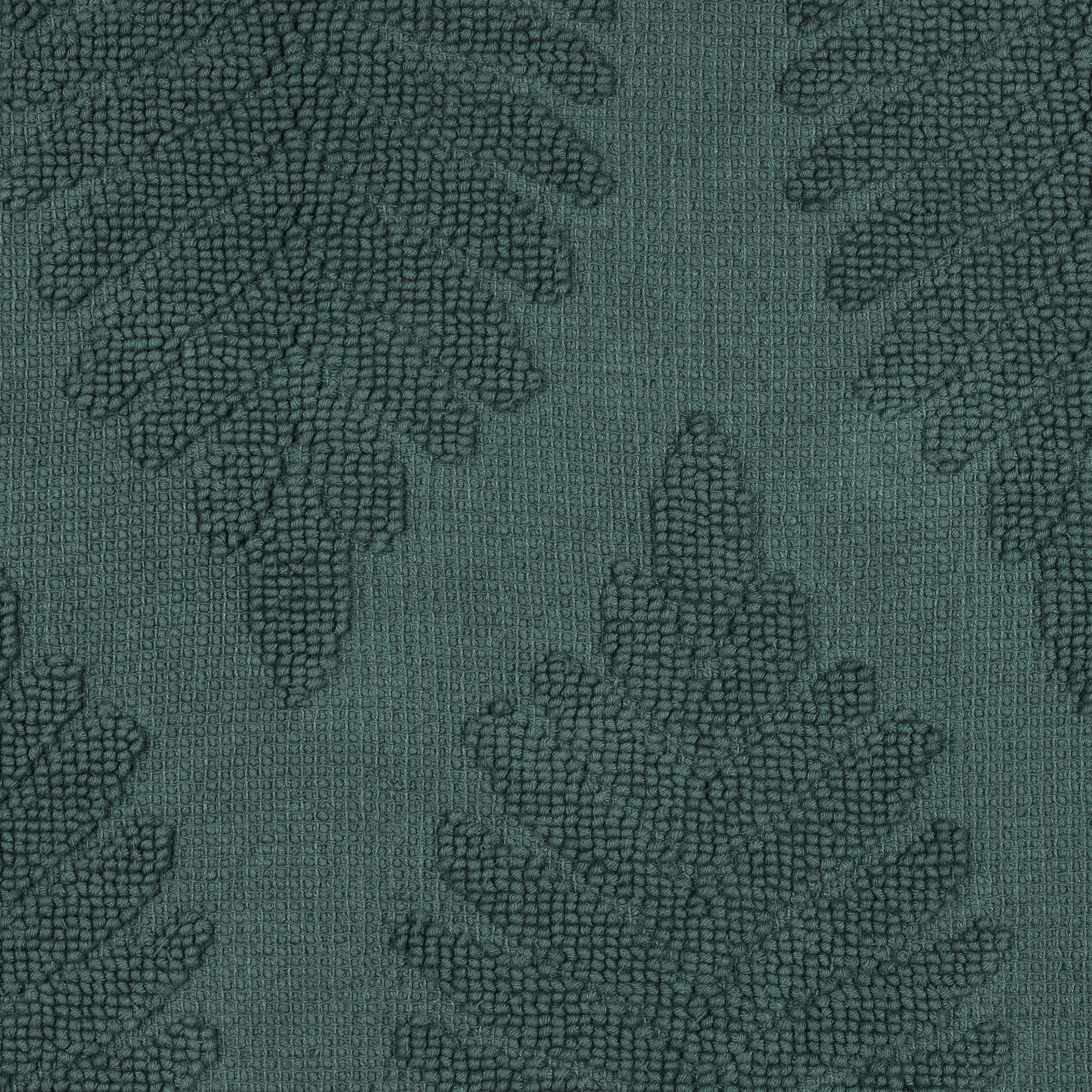 Textured bath rug featuring a fern pattern in shades of green.