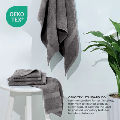 Gray towels on a white stool with a plant, featuring the Oeko-Tex logo.