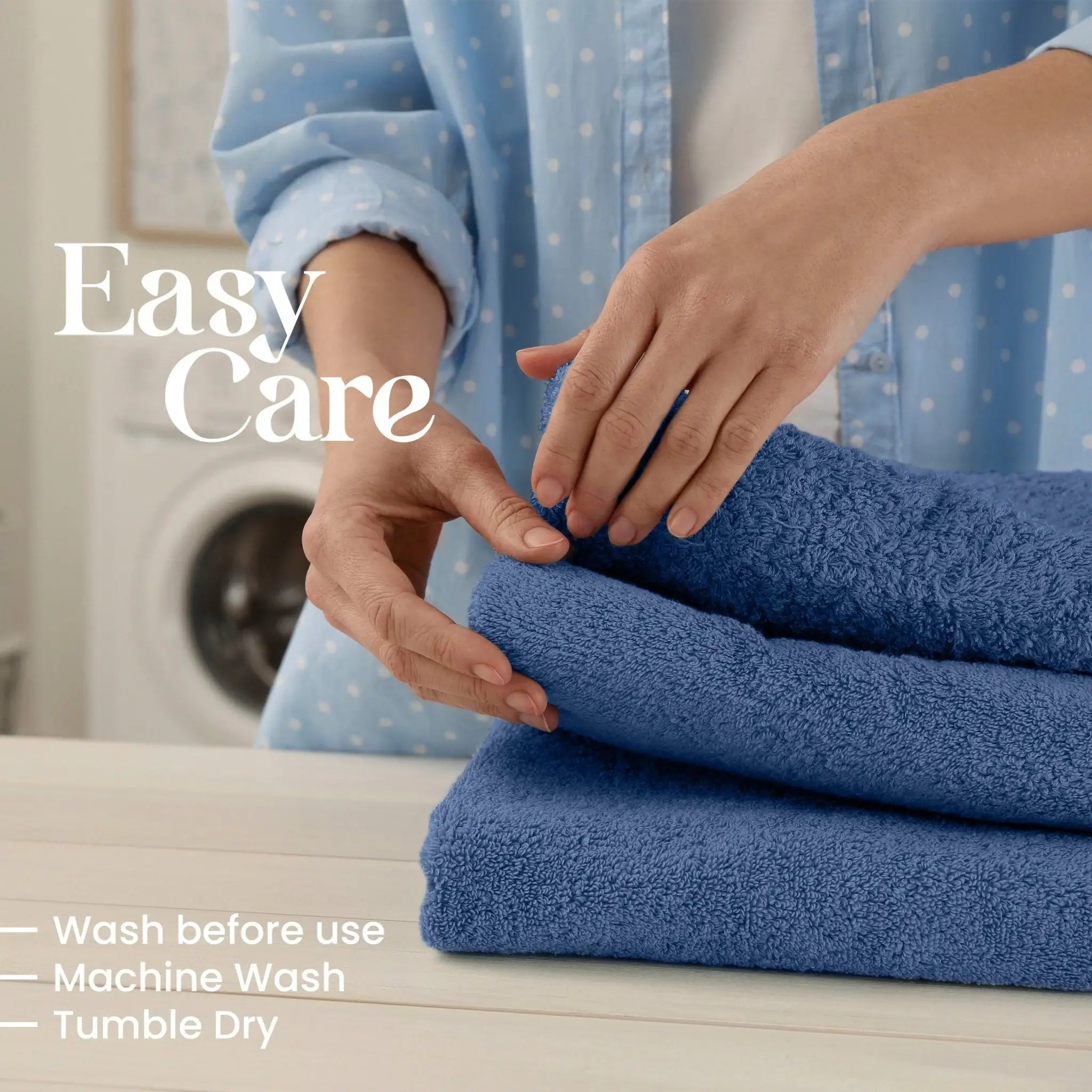 Person folding blue towels with washing machine in the background, text indicating care instructions.