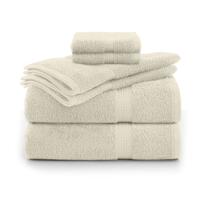 Set of ecru towels stacked on a white background