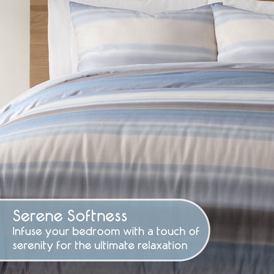 Striped comforter set on a bed, featuring text about serene softness.