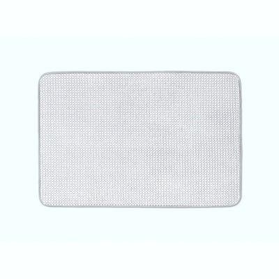A rectangular light grey bath rug, shown flat against a very light blue background.