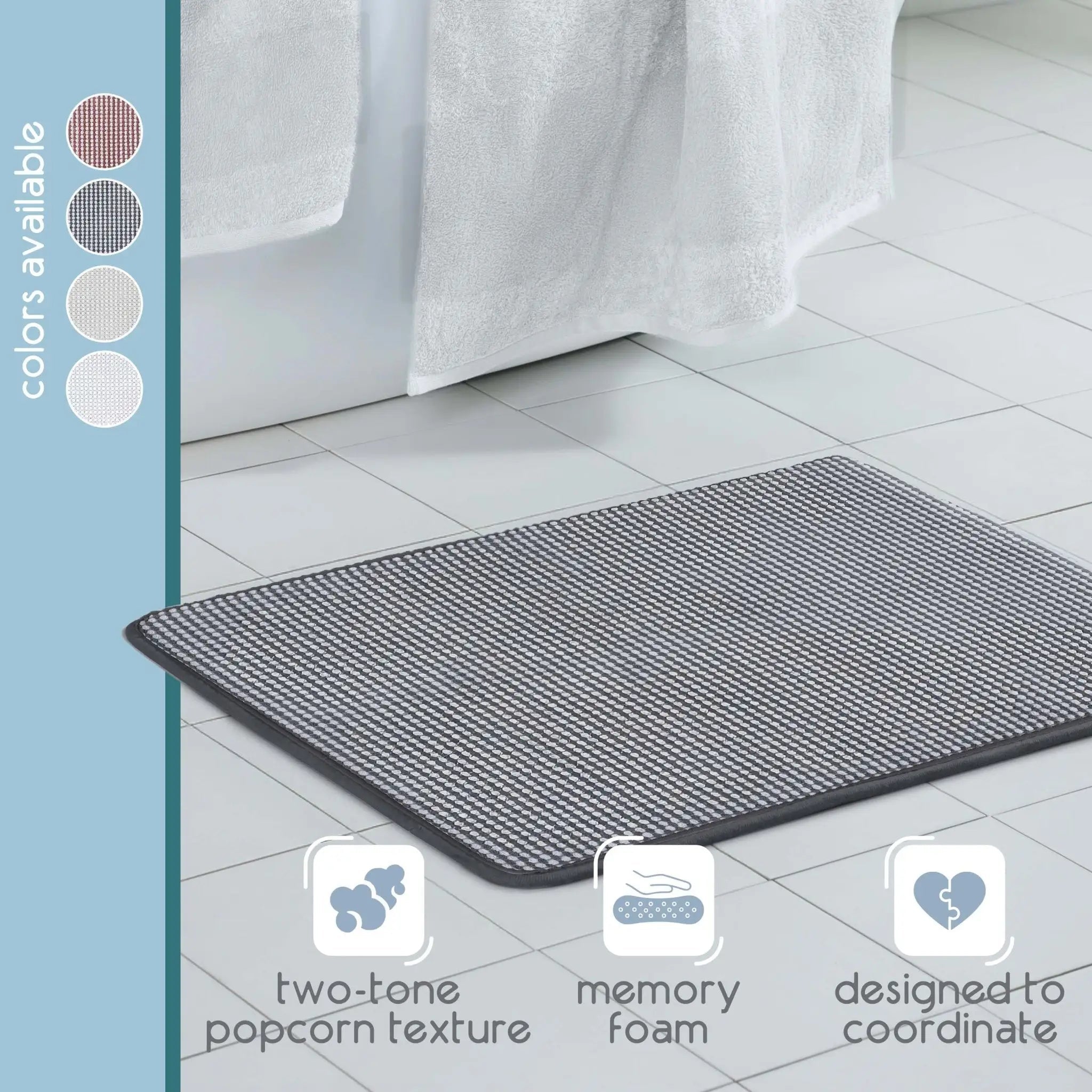 A rectangular bath rug with a black color texture, shown on a light gray tiled bathroom floor. A vertical sidebar on the left lists available colors, and three feature icons at the bottom highlight 'two-tone popcorn texture', 'memory foam', and 'designed to coordinate'.