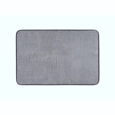 A rectangular mat with rounded corners featuring a black color, shown against a solid off-white background.