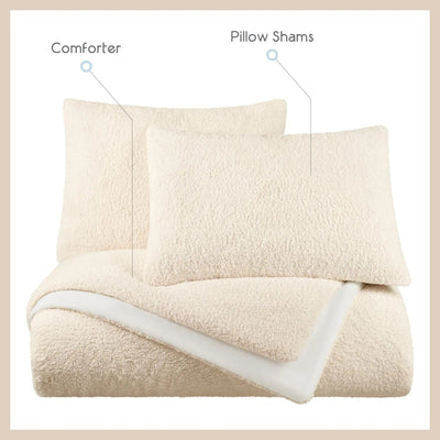 A bedding set shown on a white background with text labels pointing to the items: a cream-colored comforter and two matching pillow shams. The comforter is folded over to show a white underside, and the set is framed by a light beige border.