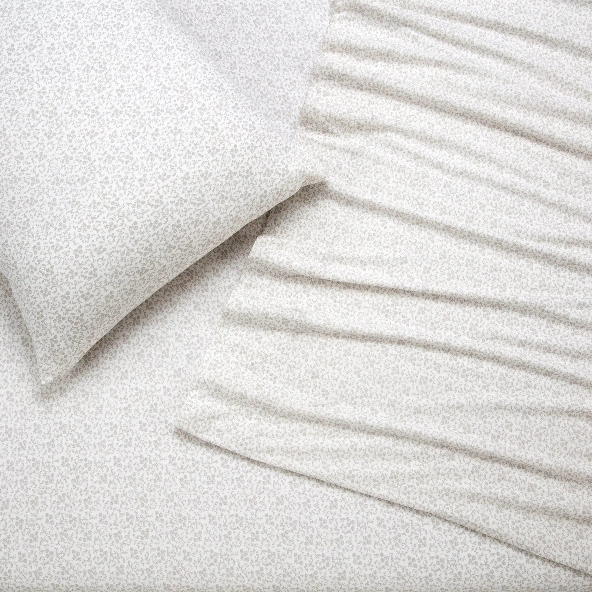 Close-up of textured white pillows and sheet