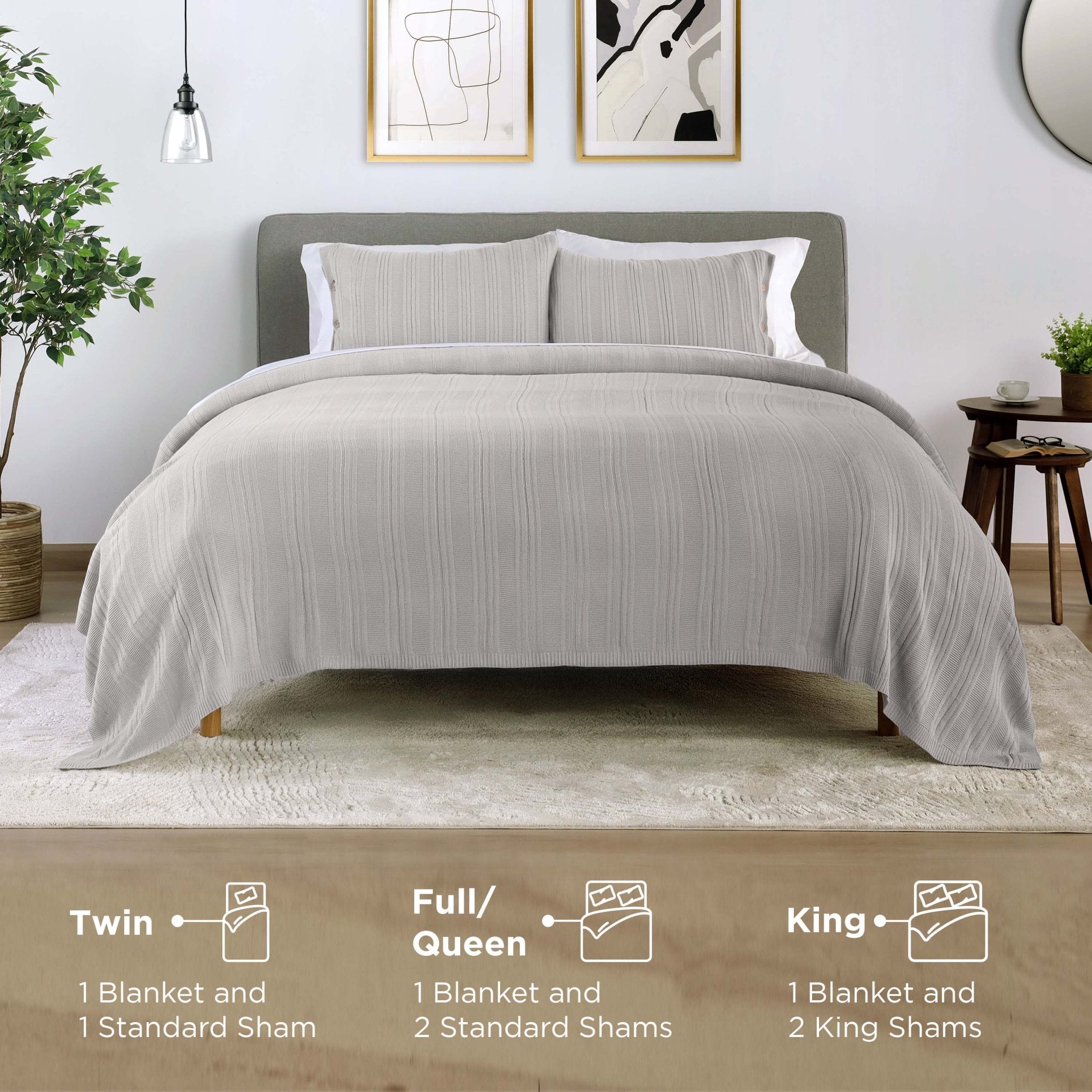 Gray bedding set on a bed in a bedroom with size information displayed.