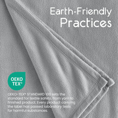 Gray blanket fabric with 'Earth-Friendly Practices' text and OEKO-TEX logo.
